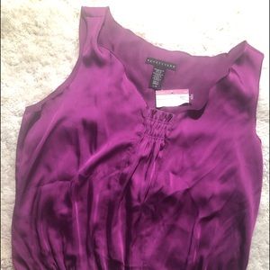 Purple sleeveless top.